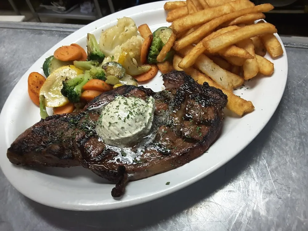 Ribeye Steak with a Garlic Butter French Fries with Veggies